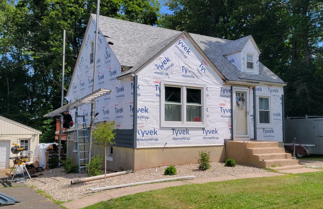 tyvek homewrap on a home in berlin before insulated vinyl siding replacement